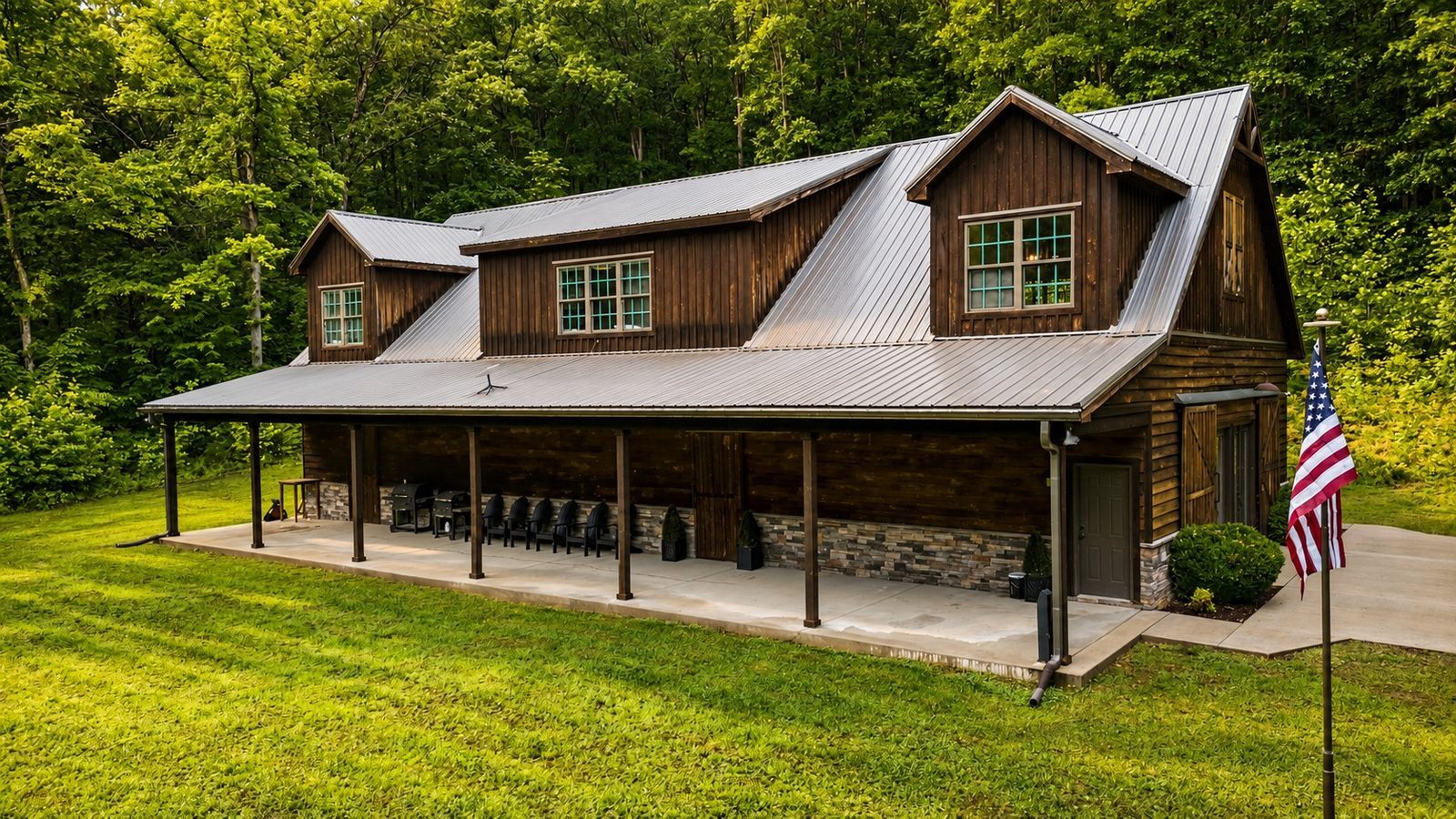Barndominium exterior with wraparound porch