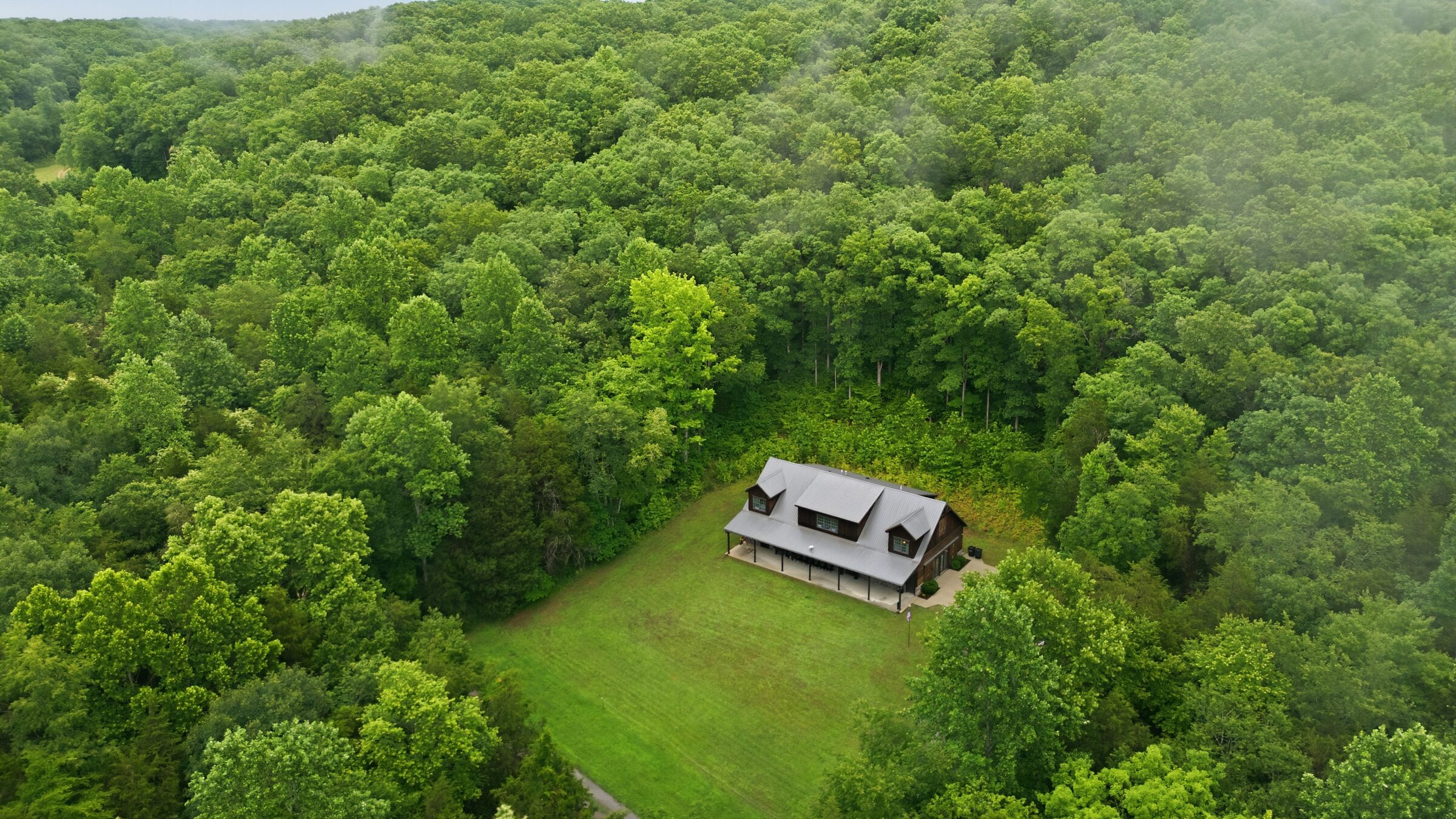 Aerial view of 240-acre estate at 7075 Pinewood Rd, Nunnelly, TN